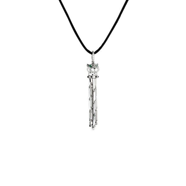 18K white gold pendant set with diamonds, emerald eyes, onyx nose, black laquer spots, on a black cord.