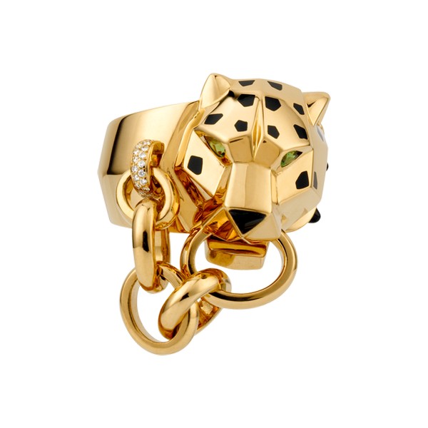 Ring in 18K yellow gold with panther head motif, diamonds, onyx nose and cones, black lacquer spots, tsavorite-garnet eyes.