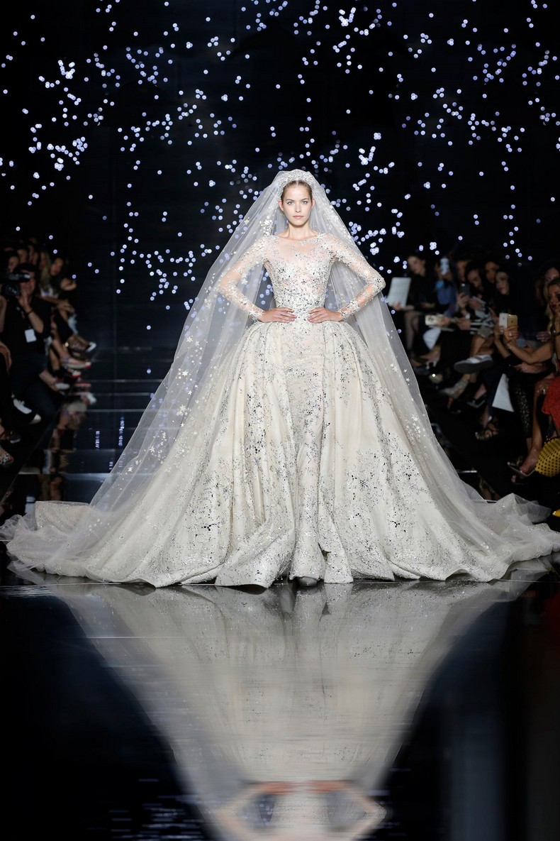 Zuhair Murad Haute Couture FW 2016 - Lunar white star and galactic dust constellation wedding gown with flared overskirt and train, worn with matching tulle vale